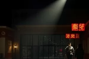 《午夜放映厅》封面，雨夜影院门口霓虹灯牌与撑伞人影